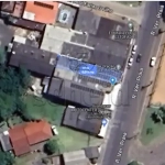 LOTE 010 - Área de 150,00m², contendo uma edificação de alvenaria de dois andares, localizado à Rua Vereador Praia, nº 32, bairro Praia na zona urbana desta cidade de Taquari/RS