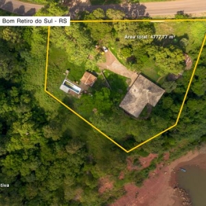 LOTE 011 - Área de 4.777,77m², contendo uma casa residencial de alvenaria com aproximadamente 300,39m², um quiosque de 38,40m² fechado com madeiras rústicas e duas piscinas, situado na Rua João Flávio Mallmann, n° 209, bairro Goiabeira, Bom Retiro do Sul/RS