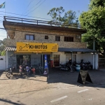 LOTE 014 - 50% do terreno correspondente a integralidade do prédio comercial e residencial